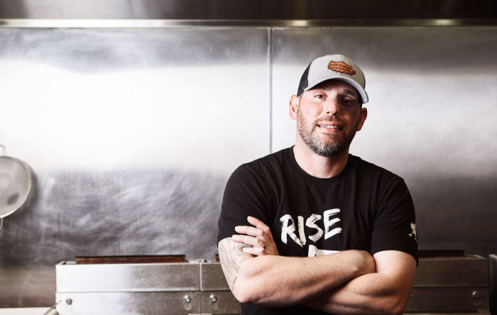 Chef Derrick Foster standing in his kitchen