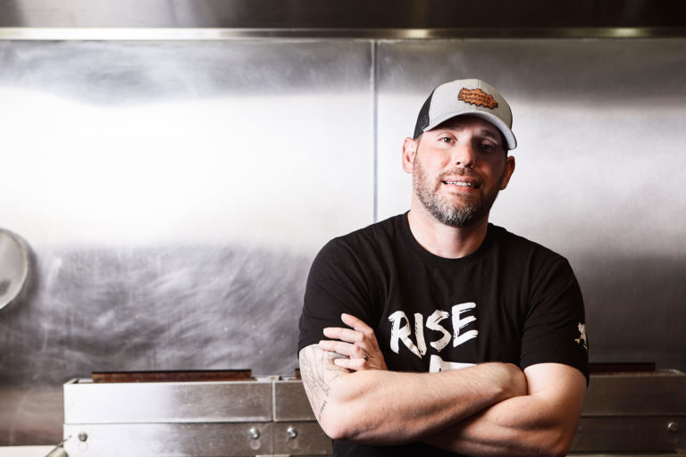 Chef Derrick Foster standing in his kitchen