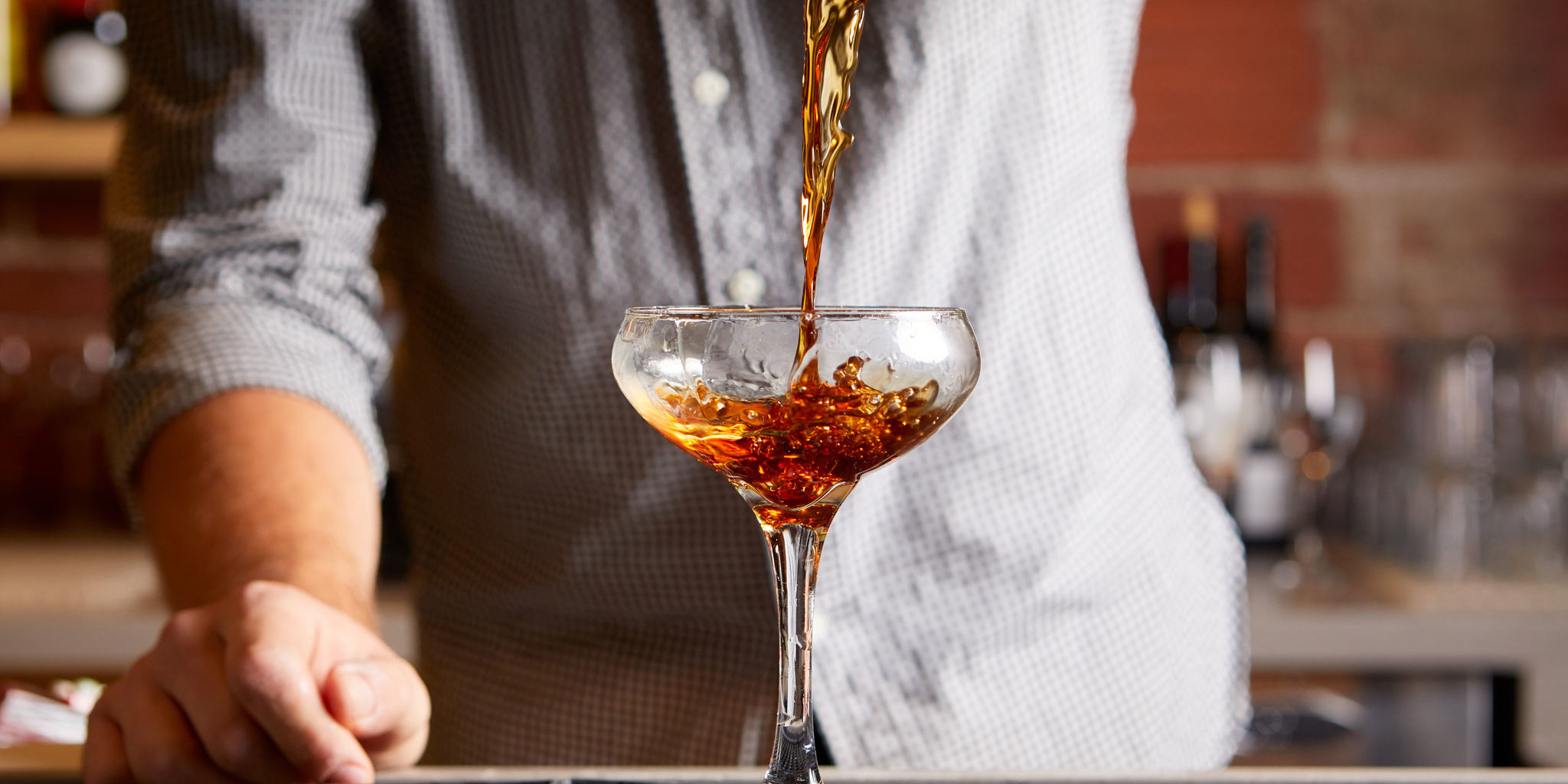 Bartender serving Rye of the Tiger cocktail