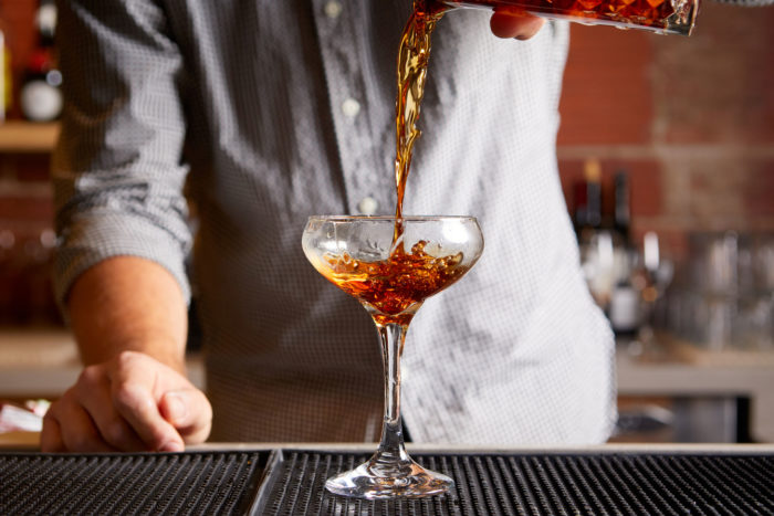 Bartender serving Rye of the Tiger cocktail