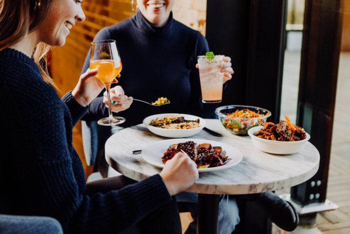 Women at a table with food
