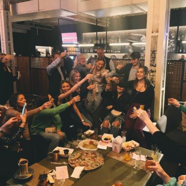 People toasting in Parlor Bar