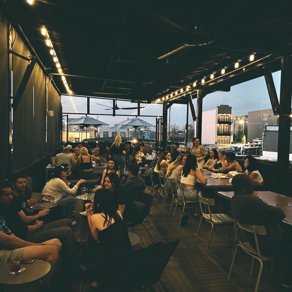 People enjoying beverages on the Parlor patio