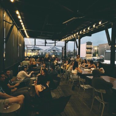 People enjoying beverages on the Parlor patio