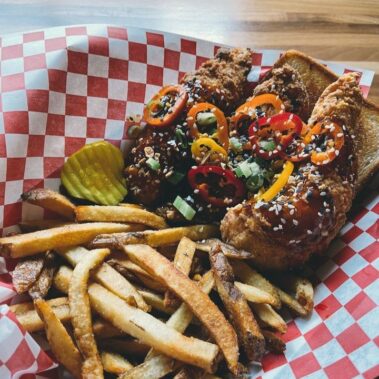 A basket of fried chicken and fries